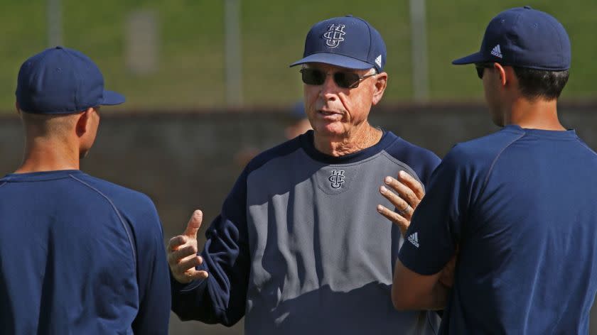 IRVINE, CA. - JUNE 10, 2014: Head coach Mike Gillespie, center, talks with coach Ben Orloff (CQ), left, and director of operations Eric Deragisch (CQ), right, during practice of the UC Irvine baseball team at Anteater Ballpark in Irvine on June 10, 2014. (Anne Cusack/Los Angeles Times)