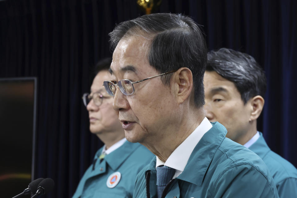 South Korean Prime Minister Han Duck-soo speaks during a briefing at the government complex in Seoul, South Korea, Friday, April 19, 2024. Desperate to end a weekslong strike by thousands of doctors, South Korea’s government said Friday it will slow down a plan to admit thousands more students to the country's medical schools from next year.(Hang Gwang-mo/Yonhap via AP)