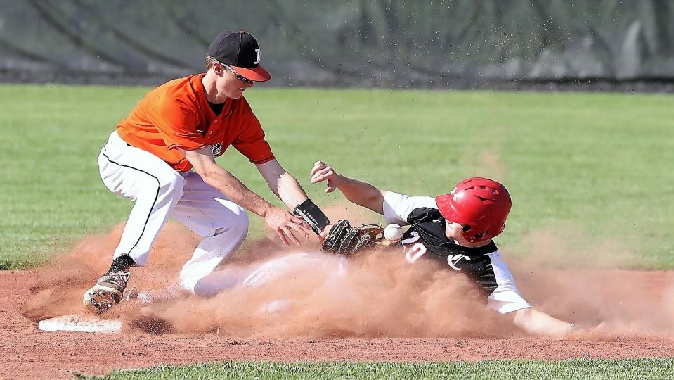 Crooksville's Austin Love slides into second base as the ball comes loose during a 3-2 win against host Ironton in a Division III sectional game on Monday. Crooksville advanced to play Ironton Rock Hill for a berth in the district.