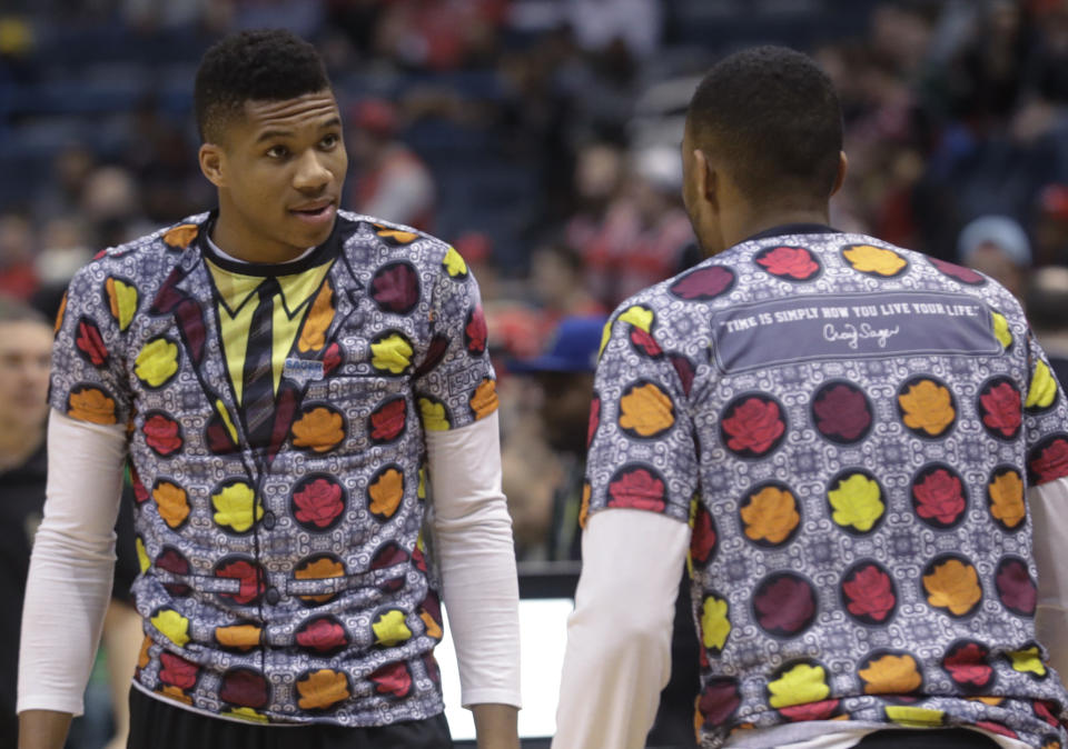 Milwaukee Bucks' Giannis Antetokounmpo and Jabari Parker wear shirts to honor NBA broadcaster Craig Sager who died earlier before an NBA basketball game against the Chicago Bulls Thursday, Dec. 15, 2016, in Milwaukee. (AP Photo/Morry Gash)