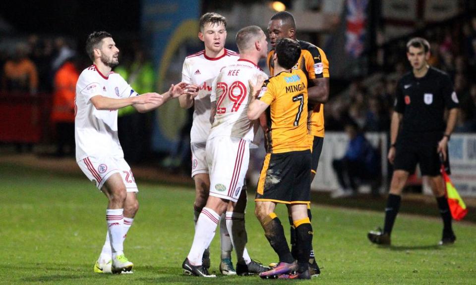 Tempers flare between Uche Ikpeazu of Cambridge United and Billy Kee.