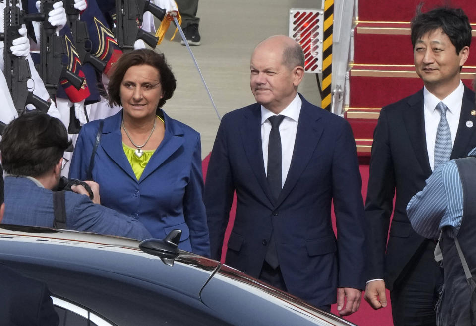 Germany's Chancellor Olaf Scholz, center right, and his wife Britta Ernst arrive at the Seoul airport in Seongnam, South Korea, Sunday, May 21, 2023. (AP Photo/Ahn Young-joon)