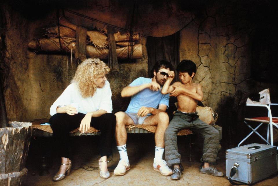 Kate Capshaw, Steven Spielberg and Ke Huy Quan on the set of 1984's Indiana Jones and the Temple of Doom. (Alamy)