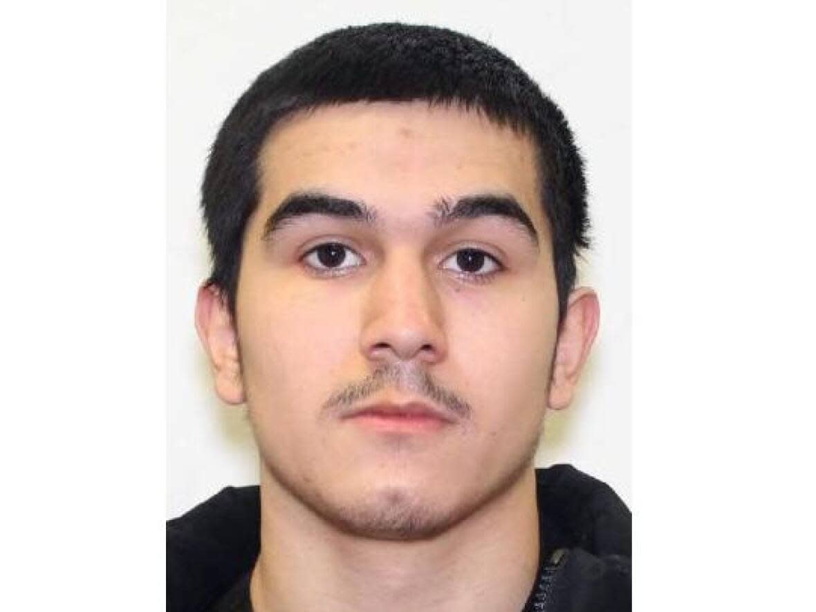 Mustafa Kadhem, from Toronto, is wanted for second-degree murder in connection with a shooting outside Woburn Collegiate Institute and should be considered armed and dangerous, police say.  (Toronto Police Service - image credit)