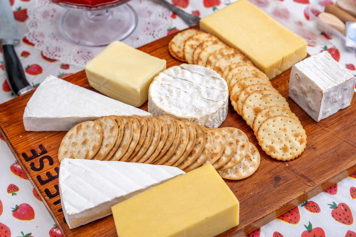 Cheeseboard and biscuits at outdoor party