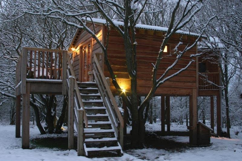 This treehouse is located in Whippingham, England, and provides a cozy escape for locals and tourists alike. It even includes a woodburning stove. Talk about cozy and romantic. <a href="https://www.tripadvisor.com/VacationRentalReview-g1770511-d2388193-Into_The_Woods_Treehouse-Whippingham_Isle_of_Wight_England.html" target="_blank">Check it out</a>.&nbsp;