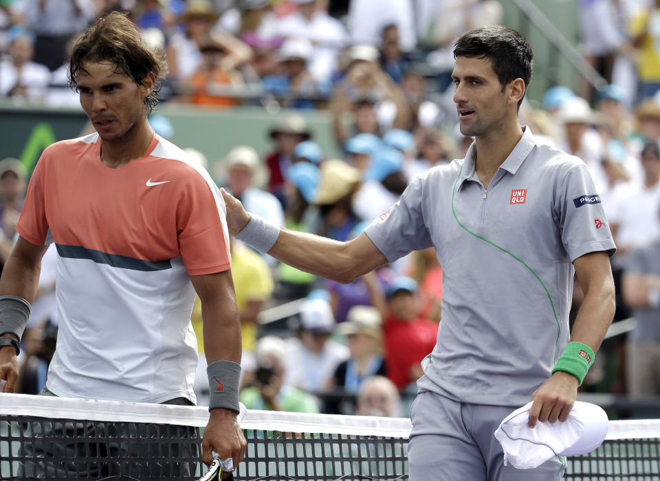 Rafael Nadal, left, of Spain, meets Novak Djokovic, right, of Serbia, at the net after Djokovic won 6-3, 6-3 in the men's final at the Sony Open Tennis tournament on Sunday, March 30, 2014, in Key Biscayne, Fla. (AP Photo/Lynne Sladky)