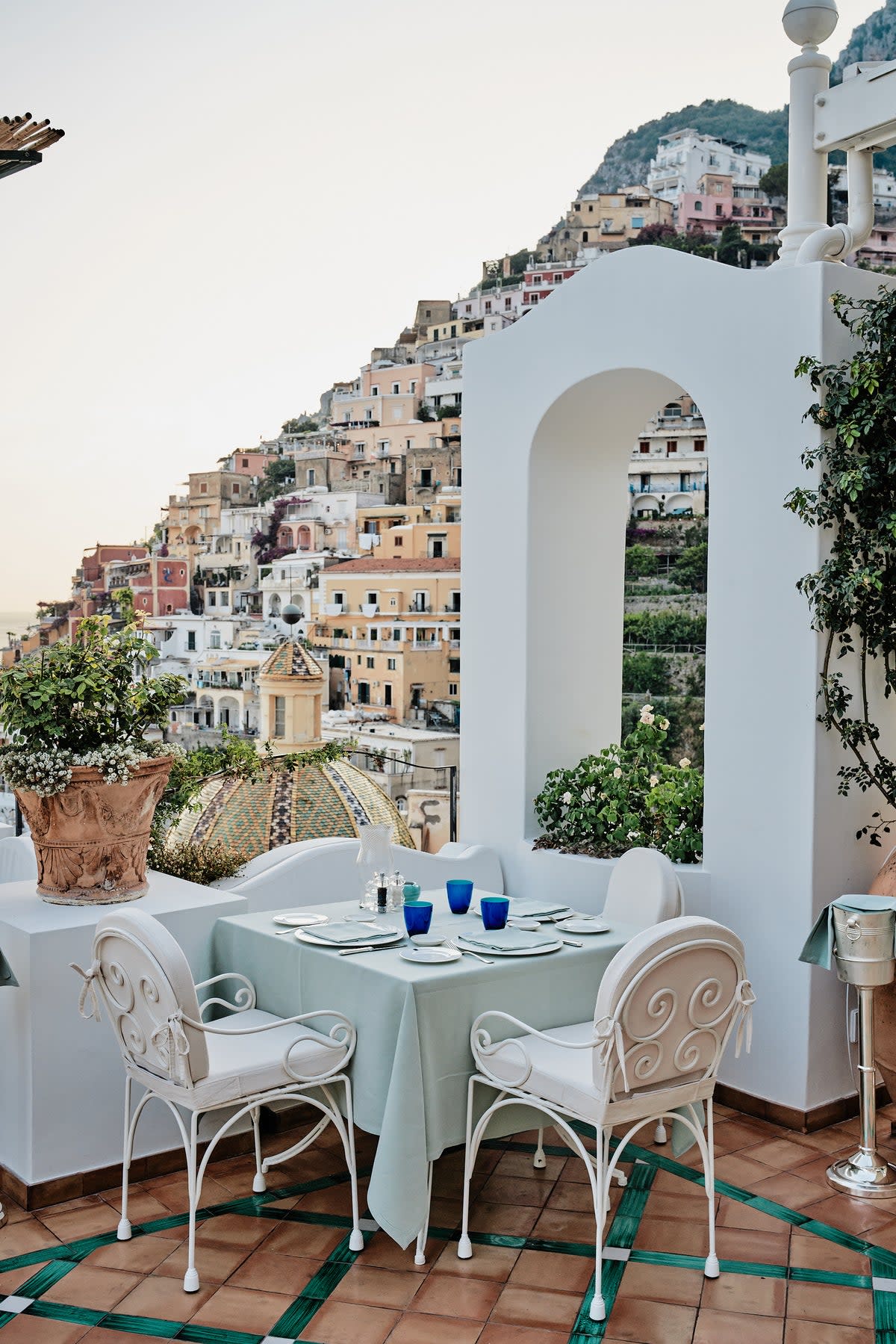 Sweeping views of Positano’s colourful cliffside from the terrace (Courtesy of Le Sirenuse Photographer/Credit Brechenmacher & Baumann)