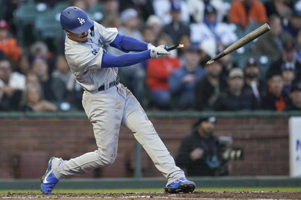 Dodgers' Miguel Vargas breaks his bat on an infield single that scored Max Muncy.