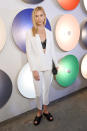 <p>Model Karlie Kloss gave a lesson in smart casual in a white suit, leather bralet and sliders for the Boss SS17 show. <i>[Photo: Getty]</i></p>