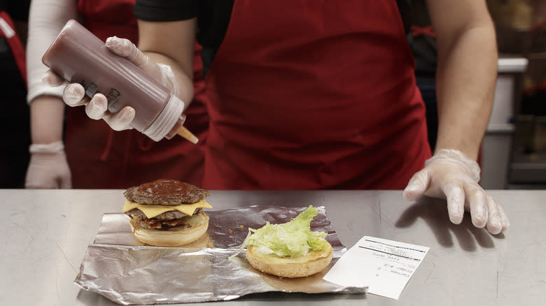 staff making five guys burger