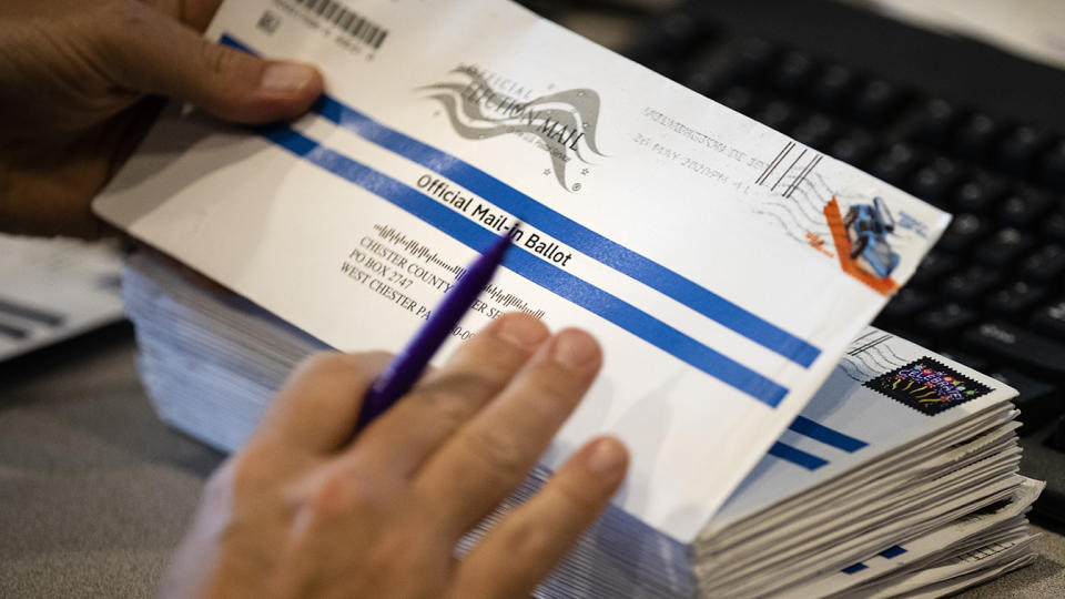 Dave Turnier processes mail-in ballots at at the Chester County Voter Services office in West Chester, Pa., prior to the primary election on May 28, 2020. (Matt Rourke/AP)