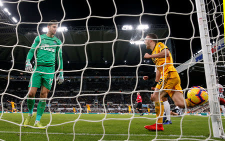 Soccer Football - Premier League - Newcastle United v Wolverhampton Wanderers - St James' Park, Newcastle, Britain - December 9, 2018 Newcastle United's Martin Dubravka looks dejected as Wolverhampton Wanderers' Diogo Jota celebrates their second goal scored by Matt Doherty (not pictured) Action Images via Reuters/Lee Smith