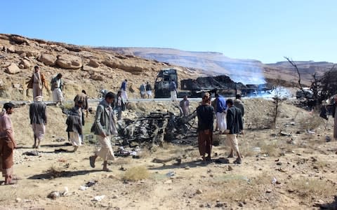 Yemenis inspect the damage of a Saudi air strike in Saada least week - Credit: Reuters