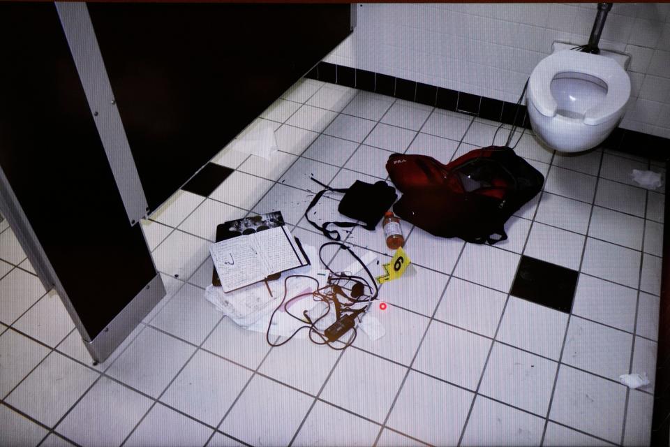 An image from a video shows the contents of the backpack belonging to Ethan Crumbley in a bathroom. The image was shown Thursday, July 27, 2023, during a court hearing before Oakland County judge Kwame Rowe in Pontiac.