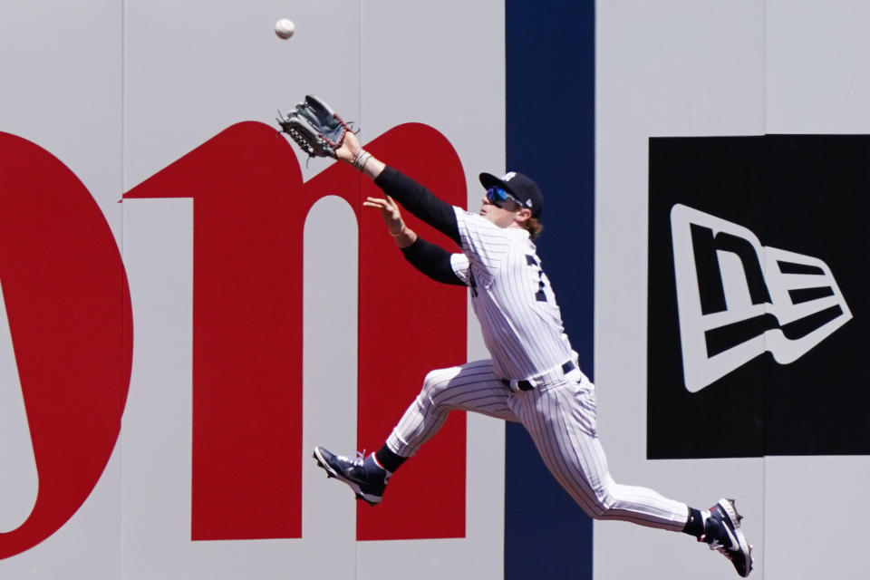 CORRECTS TO SECOND INNING, NOT FIRST - New York Yankees left fielder Clint Frazier (77) leaps for a double hit by Kansas City Royals' Hanser Alberto in the second inning of a baseball game, Thursday, June 24, 2021, at Yankee Stadium in New York. (AP Photo/Kathy Willens)