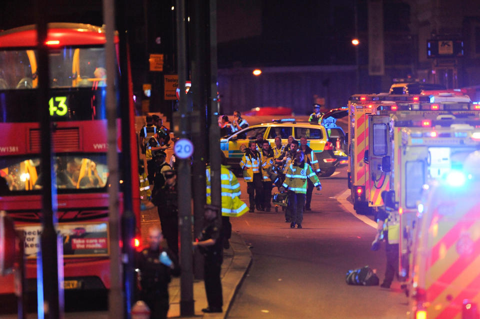 <p>Members of the emergency services attend to persons injured in an apparent terror attack on London Bridge in central London on June 3, 2017.<br> Armed police fired shots after reports of stabbings and a van hitting pedestrians on London Bridge on Saturday in an incident reminiscent of a terror attack in March just days ahead of a general election. (Daniel Sorabji/AFP/Getty Images) </p>