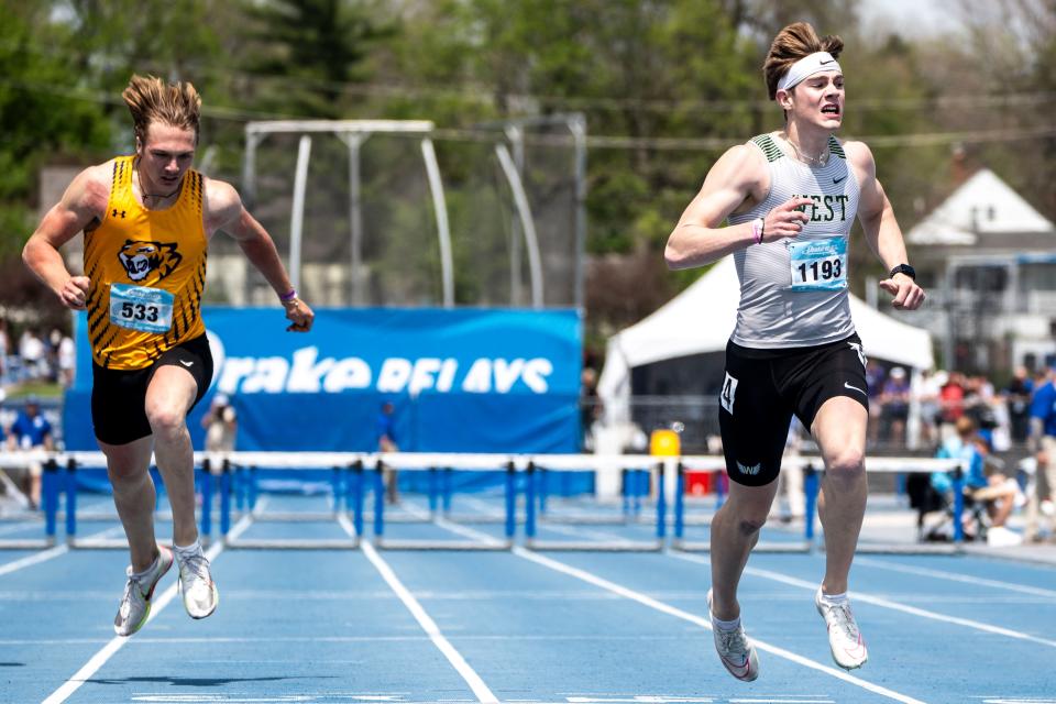 Iowa City West’s Aidan Jacobsen runs in the 400 meter hurdles during the Drake Relays at Drake Stadium on Saturday. He earned two titles at the Relays this year.