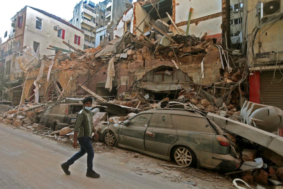 TOPSHOT - A picture shows the aftermath of a blast that tore through Lebanon's capital on August 5, 2020 in Beirut. - Rescuers searched for survivors in Beirut after a cataclysmic explosion at the port sowed devastation across entire neighbourhoods, killing more than 100 people, wounding thousands and plunging Lebanon deeper into crisis. The blast, which appeared to have been caused by a fire igniting 2,750 tonnes of ammonium nitrate left unsecured in a warehouse, was felt as far away as Cyprus, some 150 miles (240 kilometres) to the northwest. (Photo by STR / AFP) (Photo by STR/AFP via Getty Images)