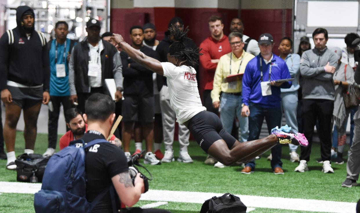 Alabama defensive back Kool-Aid McKinstry does a standing long jump at the Hank Crisp Indoor Practice Facility during the University of Alabama's Pro Day.