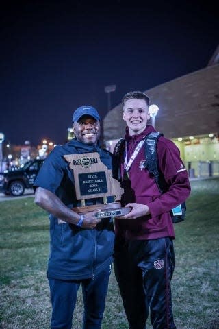 Rob Yanders and Isaac Haney pose for a photo after Kickapoo's state championship win in 2021.