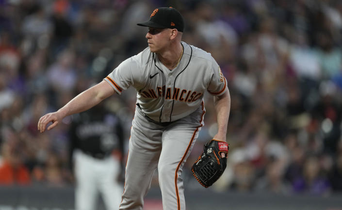 San Francisco Giants starting pitcher Anthony DeSclafani works against the Colorado Rockies in the first inning of a baseball game Saturday, Sept. 25, 2021, in Denver. (AP Photo/David Zalubowski)