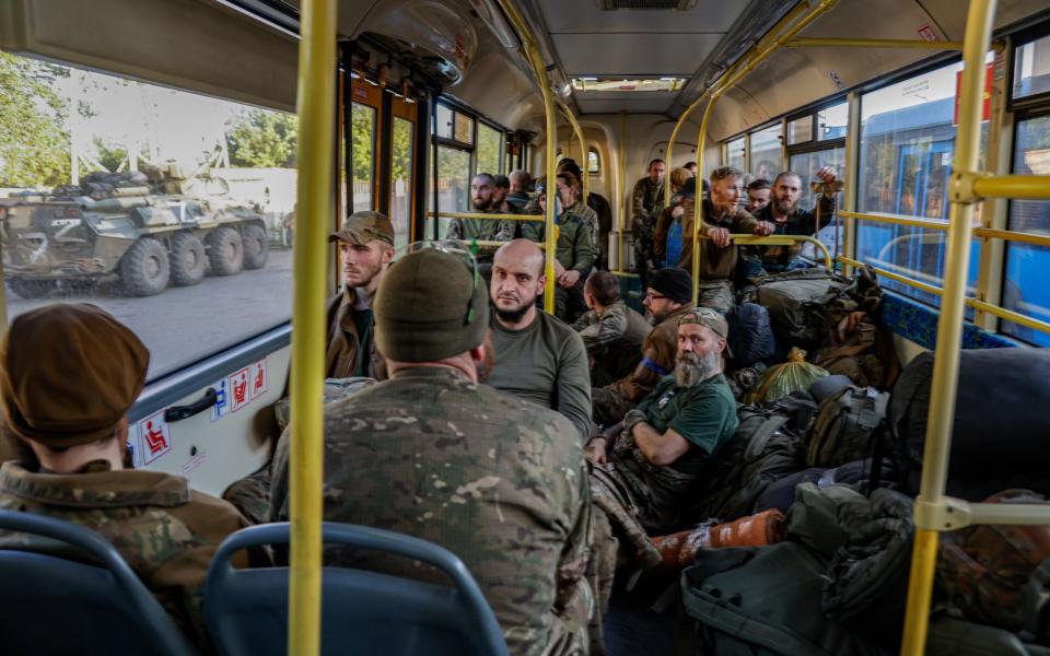 Ukrainian servicemen on a bus as they are evacuated from the besieged Azovstal steel plant in Mariupol - ALESSANDRO GUERRA/EPA-EFE/Shutterstock