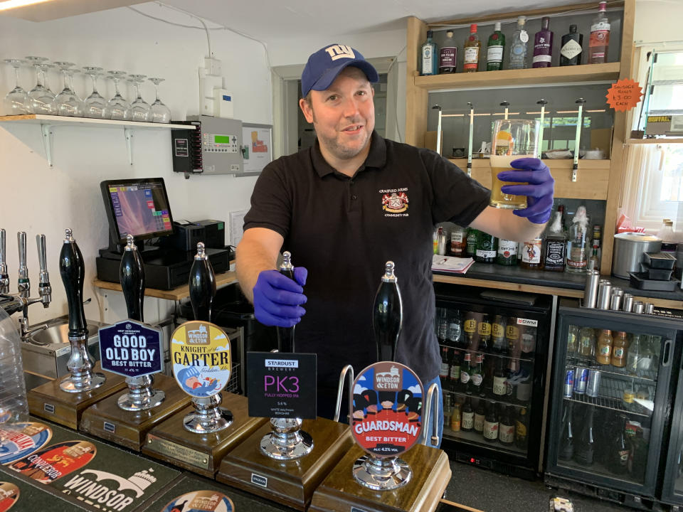 Neil Piddington, general manager of the Craufurd Arms community-owned pub in Maidenhead, checks the beer after Prime Minister Boris Johnson said that pubs, restaurants and cinemas in England will be able to reopen from July 4, with "one metre-plus" distancing measures in place as part of measures to ease the coronavirus lockdown.