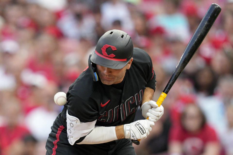 Cincinnati Reds' Joey Votto is hit by a pitch during the third inning of a baseball game against the Arizona Diamondbacks, Friday, July 21, 2023, in Cincinnati. (AP Photo/Jeff Dean)