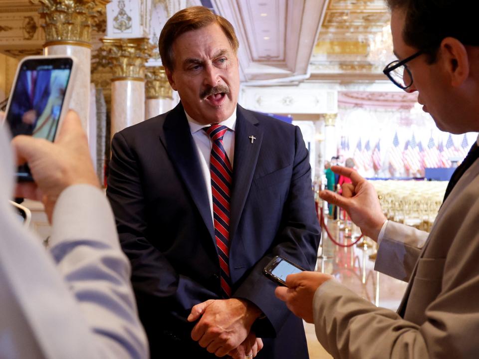 My Pillow CEO Mike Lindell speaks to reporters in a ballroom at former U.S. President Donald Trump's Mar-a-Lago estate where he says he will make a "big announcement," possibly regarding his political future, later tonight in Palm Beach, Florida, U.S. November 15, 2022.