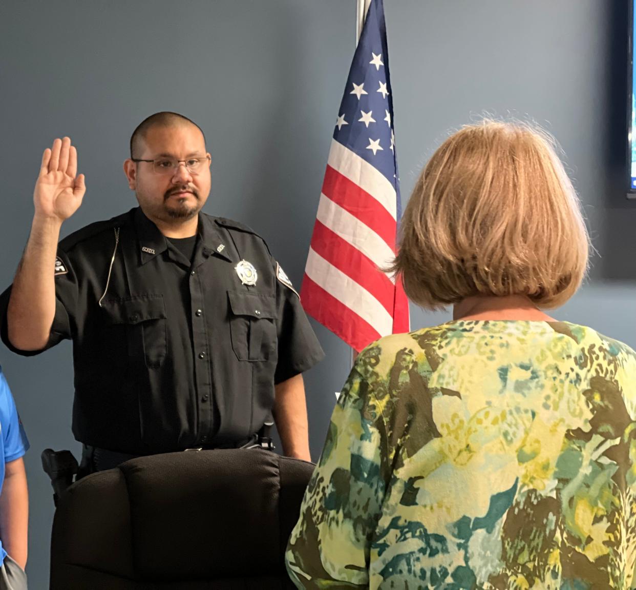 Officer Jesus Arroyo is sworn in by Spencer Clerk-Treasurer Cheryl Moke.