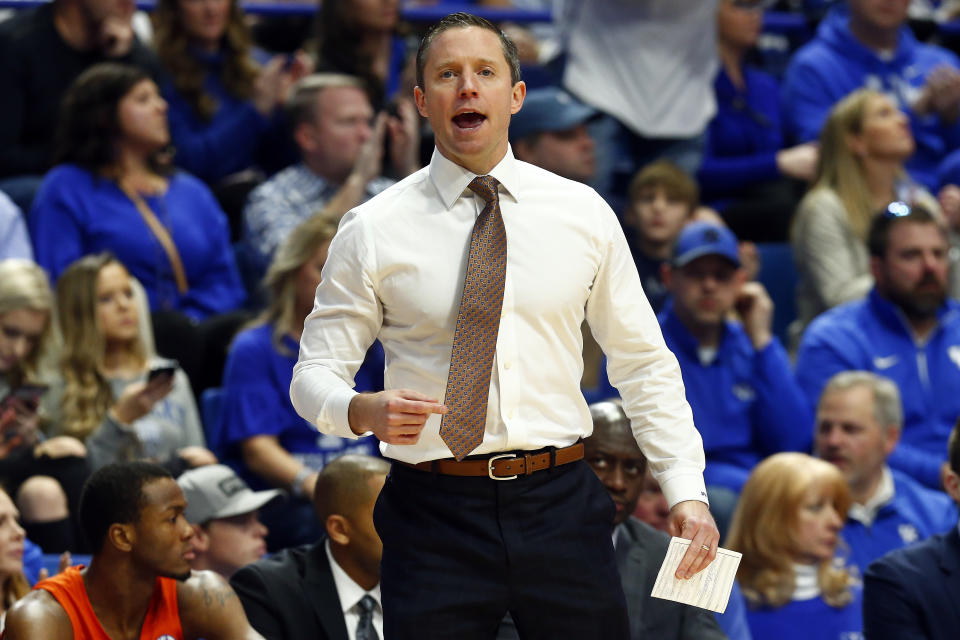 Florida head coach Mike White directs his team in the first half of an NCAA college basketball game against Kentucky in Lexington, Ky., Saturday, Feb. 22, 2020. (AP Photo/James Crisp)