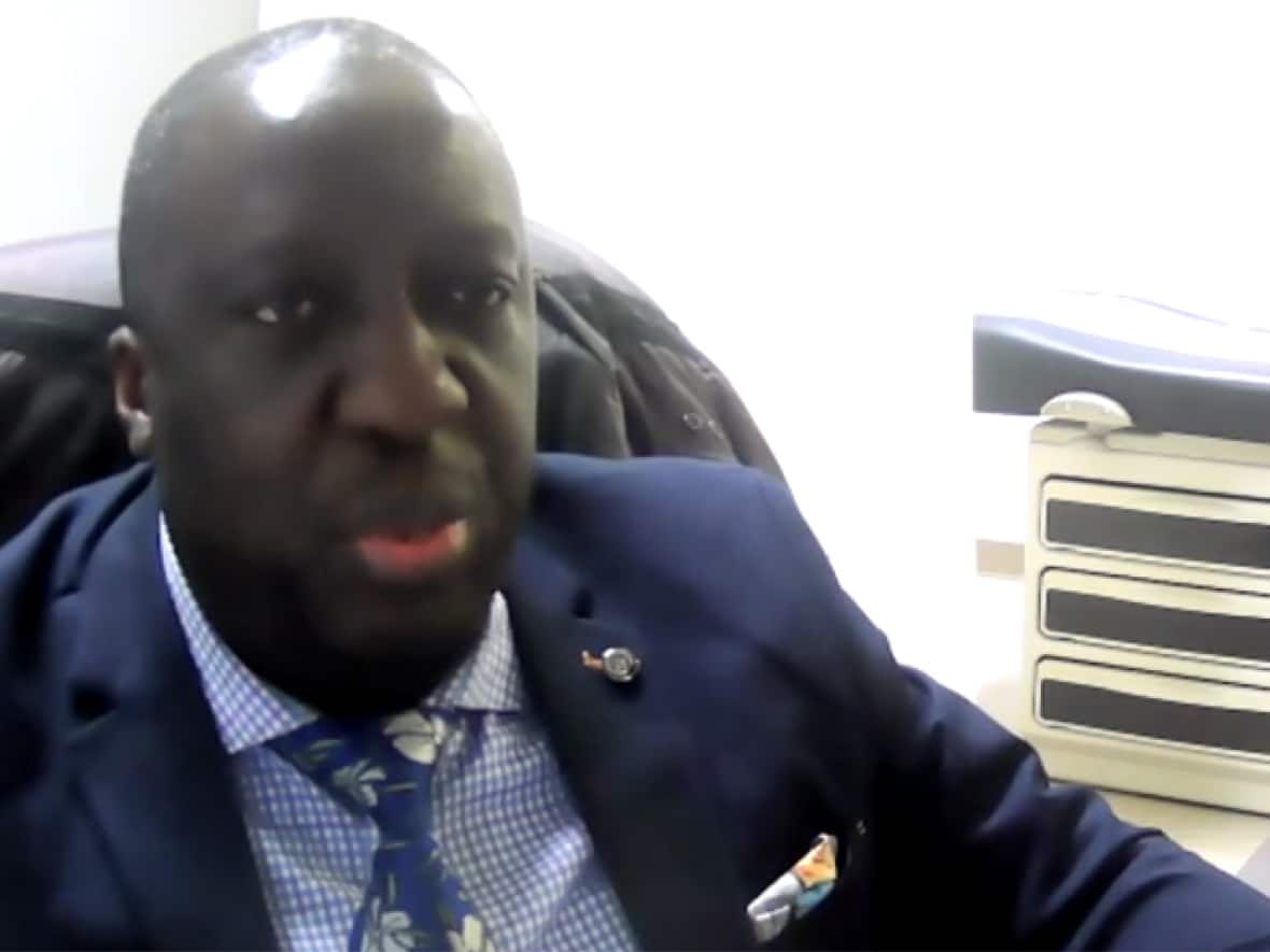 Dr. Jean-Robert Ngola, who now practises in Quebec, was accused of violating the Emergency Measures Act for not quarantining after a trip to Montreal. (Zoom - image credit)