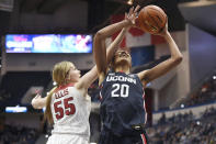 Arkansas' Emrie Ellis (55) fouls Connecticut's Olivia Nelson-Ododa in the first half of an NCAA college basketball game, Sunday, Nov. 14, 2021, in Hartford, Conn. (AP Photo/Jessica Hill)
