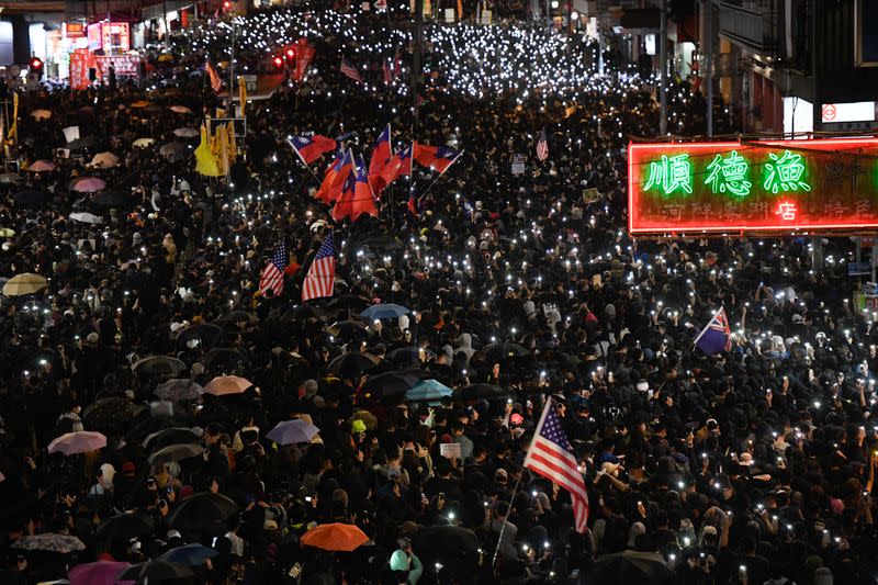 Protesters attend a Human Rights Day march in the district of Causeway Bay in Hong Kong