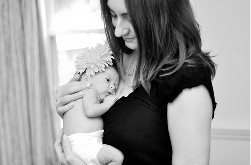 mom holding baby