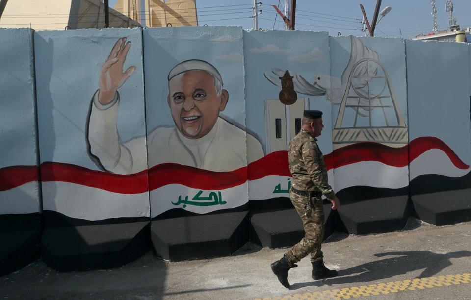 <span class="caption">A mural depicting Pope Francis on a concrete wall around the Our Lady of Salvation Church in Baghdad, in preparation for the pontiff's visit, </span> <span class="attribution"><a class="link " href="https://newsroom.ap.org/detail/APTOPIXIraqPopeVisit/800ec1c86d184458b1826db881ecd25e/photo?Query=pope%20AND%20iraq&mediaType=photo&sortBy=&dateRange=Anytime&totalCount=437&currentItemNo=5" rel="nofollow noopener" target="_blank" data-ylk="slk:AP/Photo/Khalid Mohammed;elm:context_link;itc:0;sec:content-canvas">AP/Photo/Khalid Mohammed</a></span>