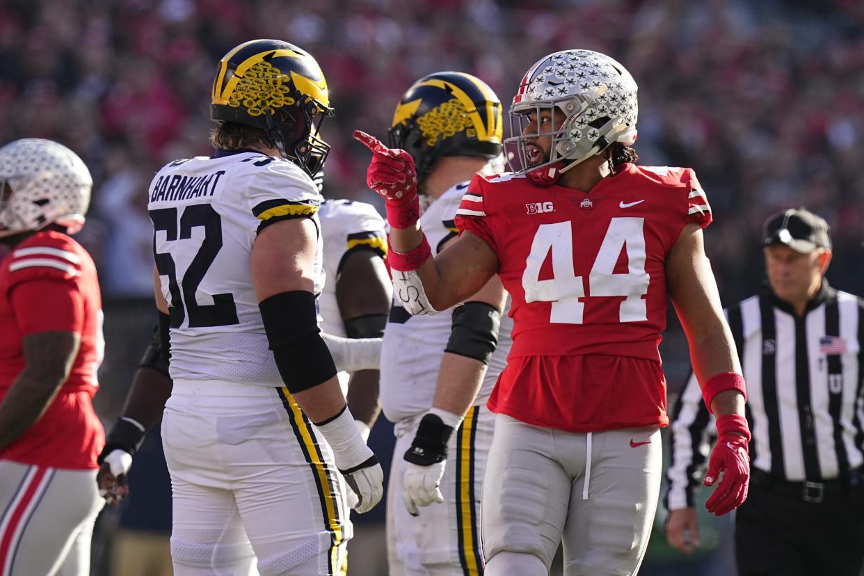 Nov 26, 2022; Columbus, Ohio, USA; Ohio State Buckeyes defensive end J.T. Tuimoloau (44) points out a false start by \m52o\ during the first half of the NCAA football game at Ohio Stadium. Mandatory Credit: Adam Cairns-The Columbus Dispatch