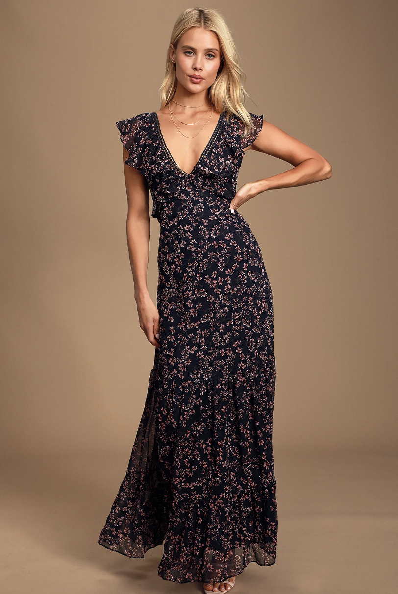 blonde model wearing pink and navy Darling Daydream Navy Blue Floral Print Ruffled Maxi Dress (photo via Lulus)