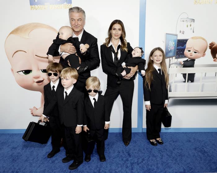 The Baldwin family at a premiere all wearing matching suits and ties