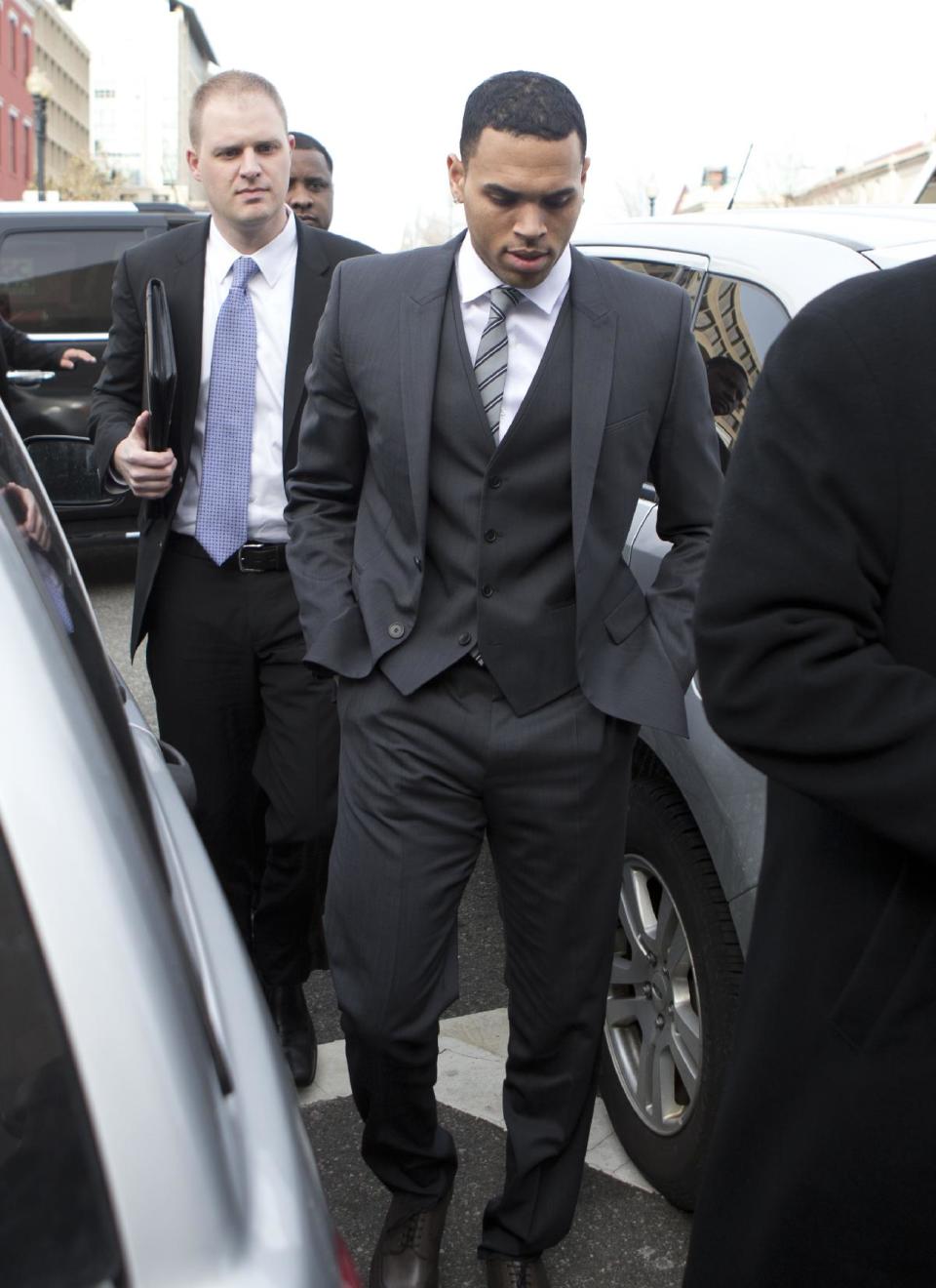 Singer Chris Brown, arrives at the District of Columbia Superior Court in Washington, Wednesday, Jan. 8, 2014, for a status hearing in a case in which he's accused of hitting a man outside a Washington hotel. The R&B singer was arrested in October after a man said the singer hit him outside the W Hotel. Brown and his bodyguard each face a misdemeanor assault charge. (AP Photo/Manuel Balce Ceneta)