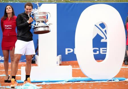 Tennis - Barcelona Open Final - Rafael Nadal of Spain v Dominic Thiem of Austria - Real Club de Tenis Barcelona, Spain - 30/04/17 - Rafael Nadal poses with a number 10 after winning the Barcelona Open title for the 10th time. REUTERS/Albert Gea