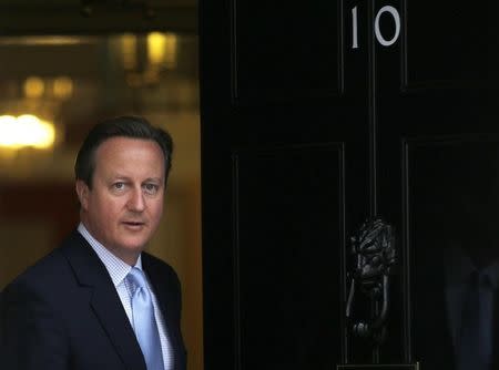 Britain's Prime Minister David Cameron prepares to greet President Nicos Anastasiades of Cyprus at Number 10 Downing Street in London, Britain September 18, 2015. REUTERS/Peter Nicholls