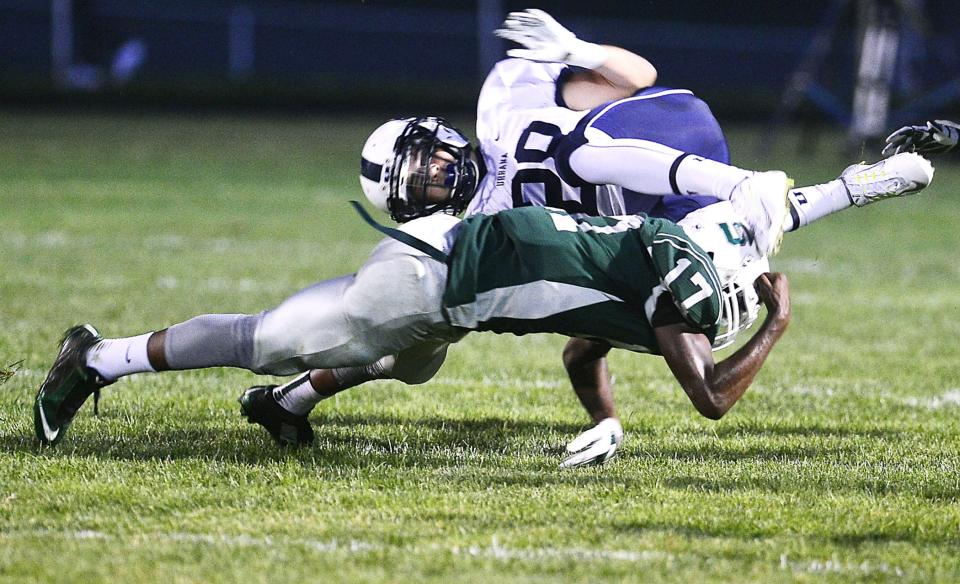 South Hagerstown’s Lincoln Ikwubuo (17) tackles Urbana’s Gage Dickens during a high school football game at School Stadium on Sept. 11, 2015. The Rebels are 63-34 over the past 10 seasons.