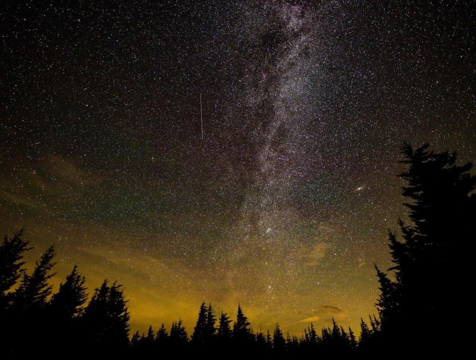 This NASA handout photo released on August 11, 2021, shows a 30 second exposure, as a meteor streaks across the sky during the annual Perseid meteor shower on August 10, 2021, in Spruce Knob, West Virginia.