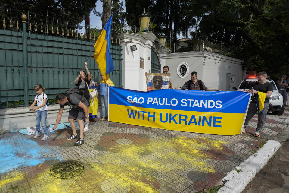 Ukrainians who live in Brazil protest outside the Russian consulate on the one-year anniversary of Russia's full-scale invasion of Ukraine in Sao Paulo, Brazil, Friday, Feb. 24, 2023. (AP Photo/Andre Penner)