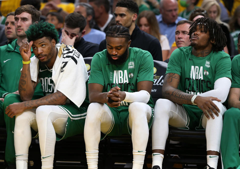 San Francisco - June 5: The Celtics Marcus Smart, Jaylen Brown and Robert Williams are pictured on the bench late in the fourth quarter as the Warriors are well on their way to tying tying the series at 1-1. The Boston Celtics visit the Golden State Warriors for Game 2 of the NBA Finals at the Chase Center in San Francisco, CA on June 5, 2022. (Photo by Jim Davis/The Boston Globe via Getty Images)