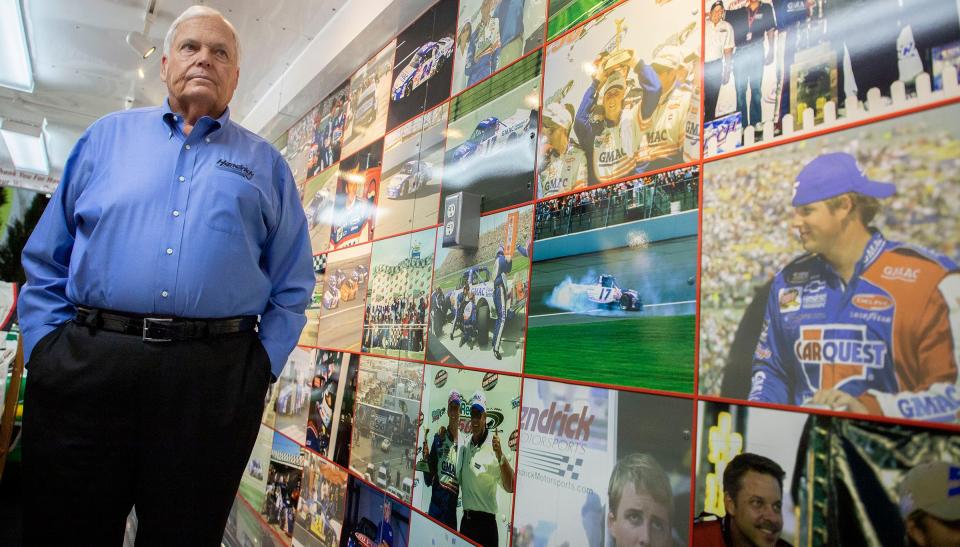 Rick Hendrick pauses to look at the wall of photos that line the trailer from his late son Ricky Hendrick's race team on display inside the 58,000-square-foot Heritage Center in Concord, North Carolina, on July 25, 2023.