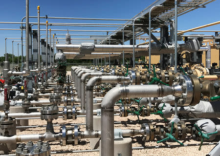 FILE PHOTO: Equipment used to process carbon dioxide, crude oil and water is seen at an Occidental Petroleum Corp enhanced oil recovery project in Hobbs, New Mexico, U.S. on May 3, 2017. REUTERS/Ernest Scheyder/File Photo