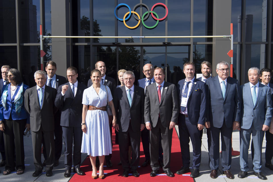 International Olympic Committee (IOC) president Thomas Bach from Germany, center, poses with Sweden's Crown Princess Victoria, center left, and Swedish Prime Minister Stefan Lofven, center right, and members of the candidate for the Olympic Winter Games 2026 Stockholm-Are delegation at the Olympic Museum, in Lausanne, Switzerland, Sunday, June 23, 2019. The host city of the 2026 Olympic Winter Games will be decided in Lausanne on Monday. (Laurent Gillieron/Keystone via AP))